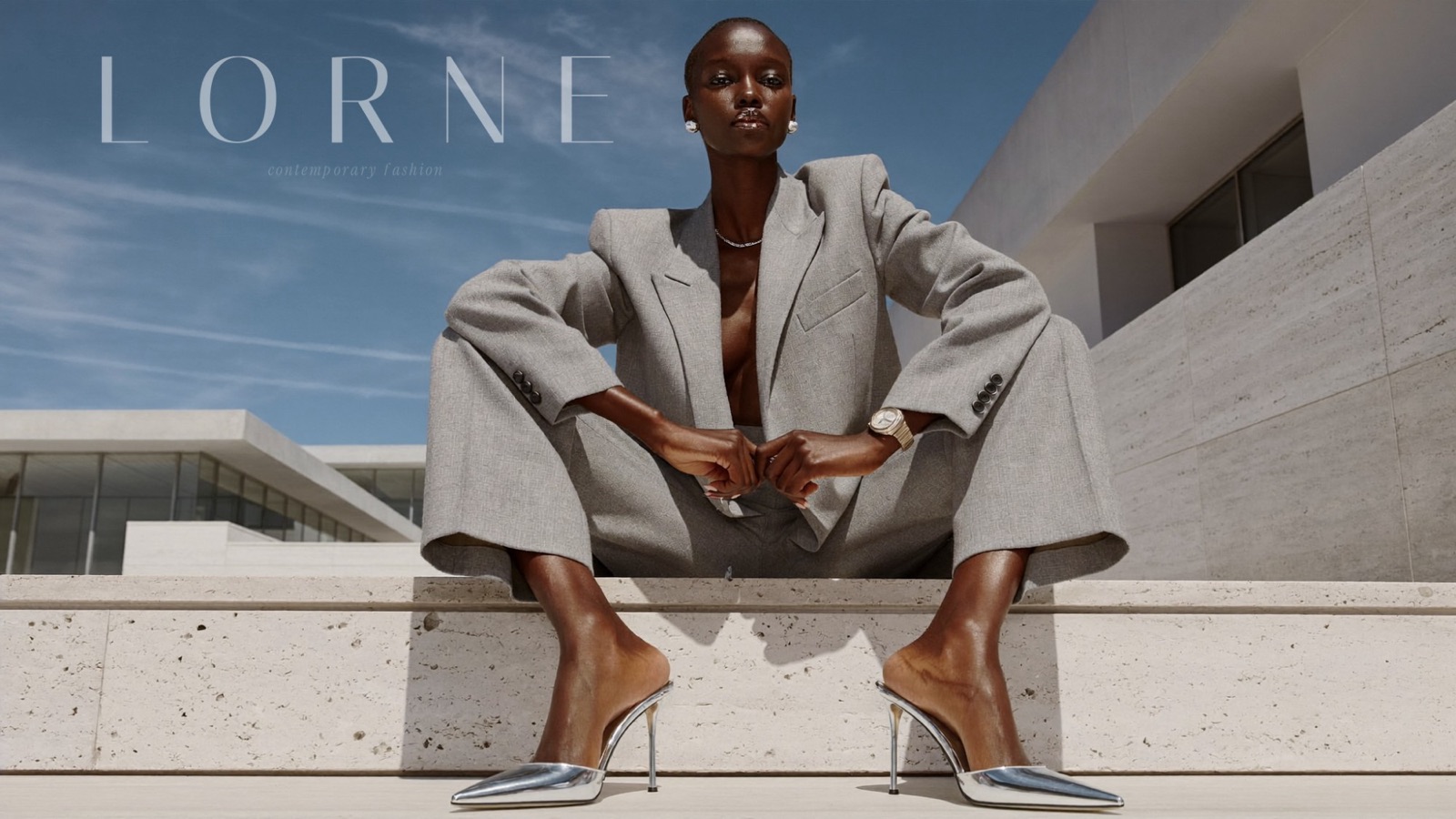 LORNE contemporary fashion campaign — model on travertine steps